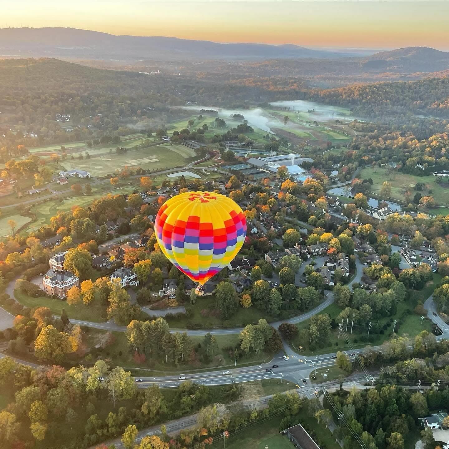 Aerial view of balloon over fall foliage in Charlottesville